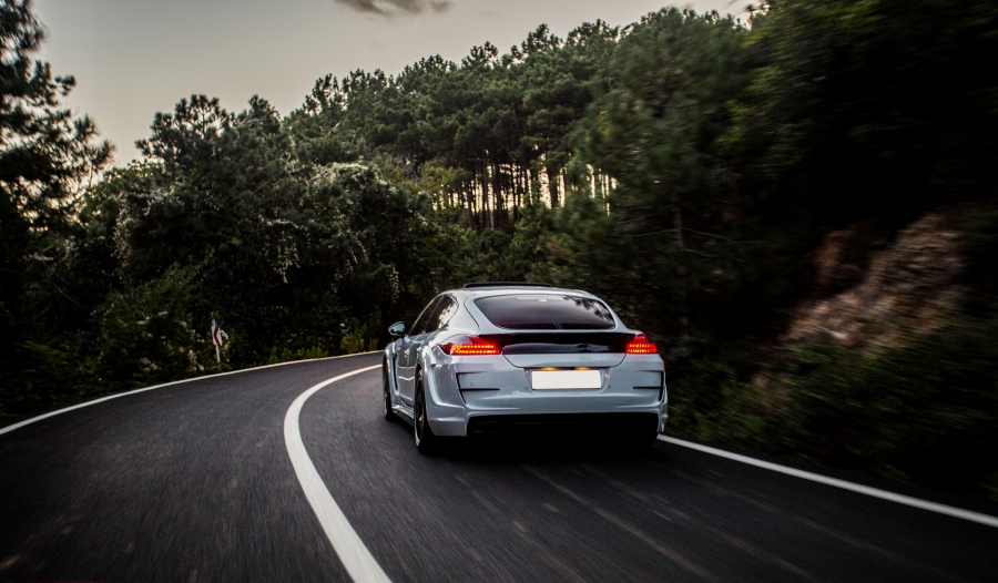 size_sport-car-with-black-white-autotuning-driving-forest.jpg